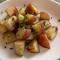 Roasted potatoes · Wood-oven baked roasted potatoes.