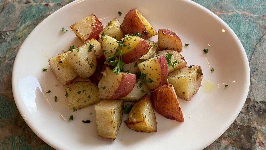 Roasted potatoes · Wood-oven baked roasted potatoes.