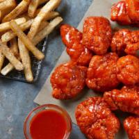 12 Boneless Wings · 12 Boneless Wings served with seasoned fries and your choice of Ranch or Blue Cheese.