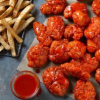 24 Boneless Wings · 24 Boneless Wings served with seasoned fries and your choice of Ranch or Blue Cheese.