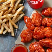 Boneless Wings Combo · 12 Boneless Wings served with seasoned fries and a Fountain Drink. Includes Ranch or Blue Ch...