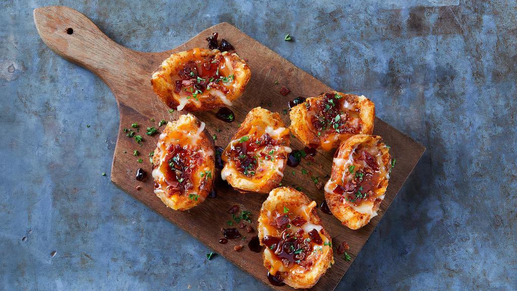 Bacon Whiskey-Glazed Potato Skins · 6 Potato skins loaded with melted cheese, crispy bacon and drizzled with Signature Whiskey-Glaze.