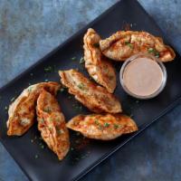 Cajun-Fried Pot Stickers · Fried pork dumplings with spicy Cajun seasoning and served with BBQ Ranch dressing.