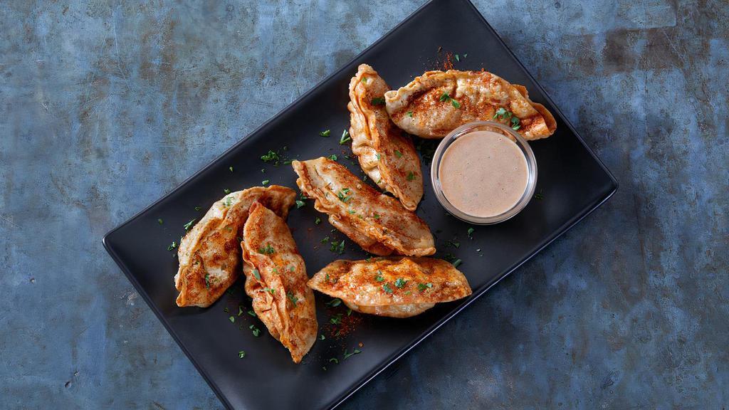 Cajun-Fried Pot Stickers · Fried pork dumplings with spicy Cajun seasoning and served with BBQ Ranch dressing.