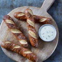 Warm Pretzels · Warm pretzels with hot poblano queso and green onions.