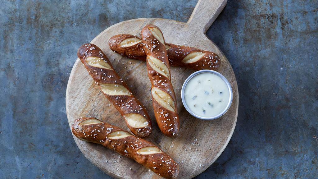 Warm Pretzels · Warm pretzels with hot poblano queso and green onions.