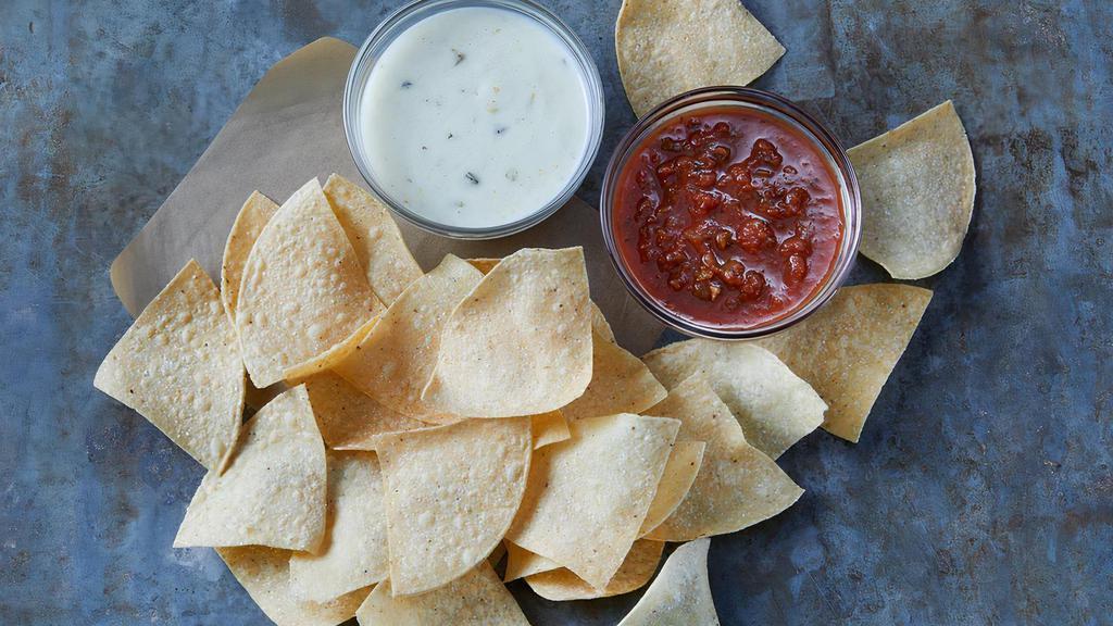 Queso And Salsa With Chips · Tortilla chips served with hot poblano queso and salsa.