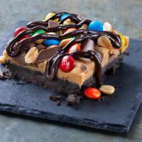 Fully Loaded Fudge · Creamy peanut butter & M&M bar layered atop an OREO Cookie crust