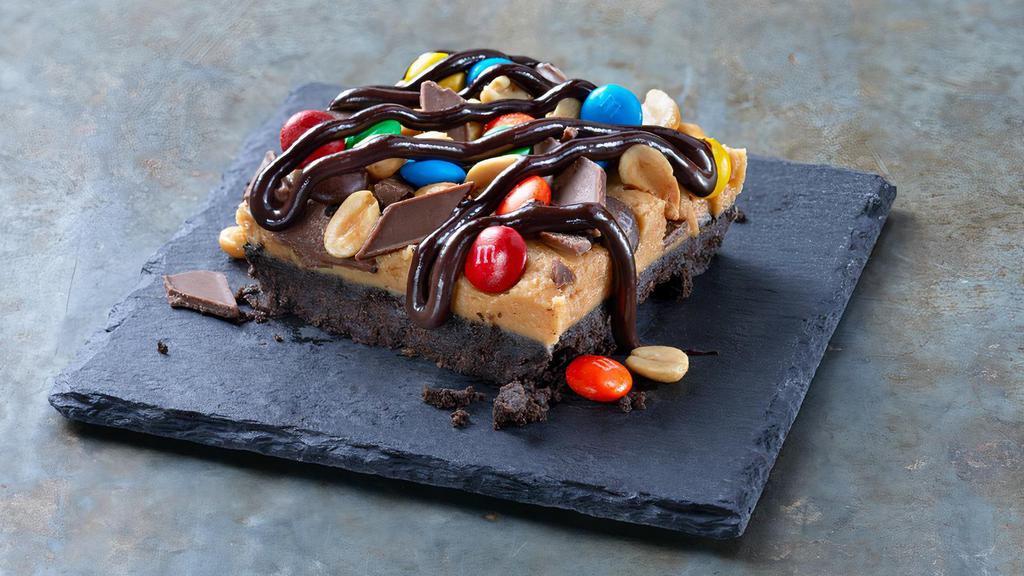 Fully Loaded Fudge · Creamy peanut butter & M&M bar layered atop an OREO Cookie crust