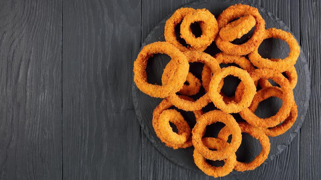 Onion Rings · A basket of flavorful onion rings fried for a crispy sensation with a side of marinara sauce.
