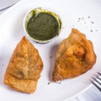 Samosa (2 Pieces) · Pastry puff filled with spiced potatoes and green peas.