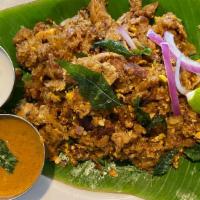 Chicken Kothu Parotta · Multi-layered parotta hand chopped and mixed with chicken and egg.