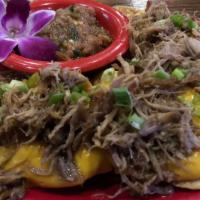 Kalua Pork Nachos · corn tortilla chips, cheese sauce, kalua pork, green onions, pineapple salsa