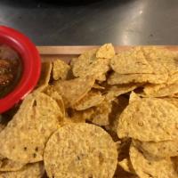 Chips & Pineapple Salsa · Corn tortilla chips, served with our house made pineapple salsa.