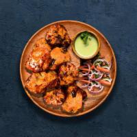 Chicken Tikka Kebab · Tender pieces of chicken marinated in yogurt, glazed in a traditional Indian clay oven.