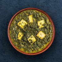 Saag Paneer · Slowly cooked farm-fresh spinach studded with perfectly fried cottage cheese cubes.