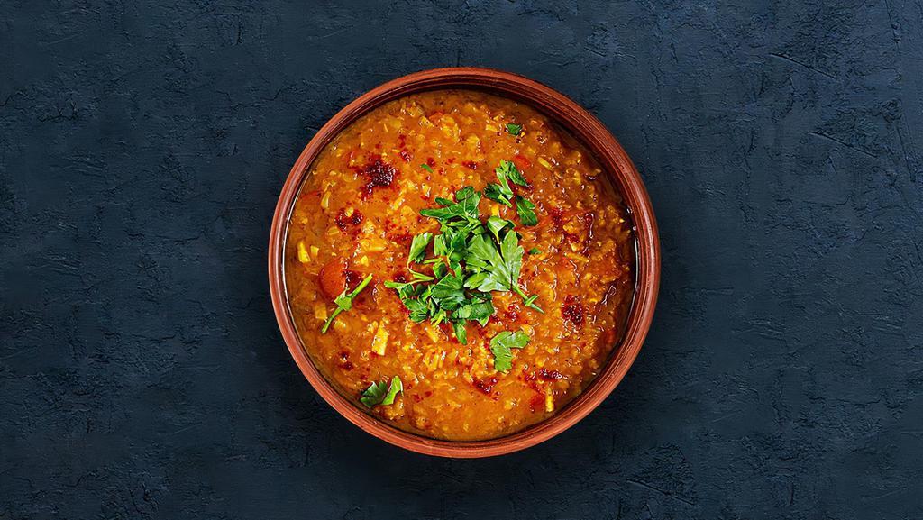 Dal Tadka · Slow-cooked lentils tempered with herbs and whole red chillies.