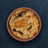 Hyderabadi Chicken Biryani · Long grain basmati rice cooked with tender chicken and aromatic Indian herbs.