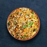 Hyderabadi Veg Biryani · Long grain basmati rice cooked with farm-fresh vegetables and aromatic Indian herbs.