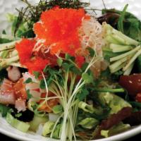 K-Chirashi · Raw fish with rice and lettuce with chili paste sauce.
