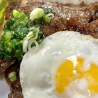 40. Cơm Sườn Hột Gà Ốpla / Grilled Pork Chop, & Egg Over Steamed Rice · 