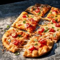 Margherita Flatbread Pizza · 820 Cal. Grape tomatoes, fresh mozzarella and our shredded fontina and mozzarella blend with...