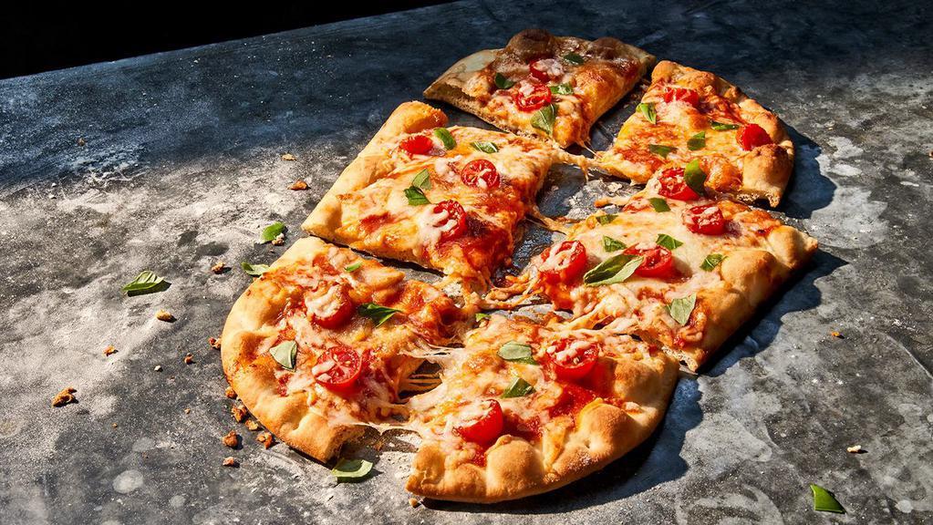 Margherita Flatbread Pizza · 820 Cal. Grape tomatoes, fresh mozzarella and our shredded fontina and mozzarella blend with tomato bell pepper sauce on our flatbread, topped with fresh basil. Allergens: Contains Wheat, Milk
