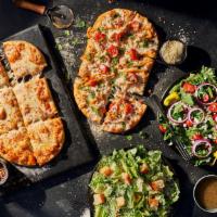 2 Flatbread Pizza Family Feast With Vanilla Cinnamon Rolls · A meal to feed the whole family, including any 2 Flatbread Pizzas, 2 whole salads and 4 Vani...
