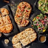 3 Flatbread Pizza Family Feast With Vanilla Cinnamon Rolls · A meal to feed the whole family, including any 3 Flatbread Pizzas, 2 whole salads, and 4 Van...