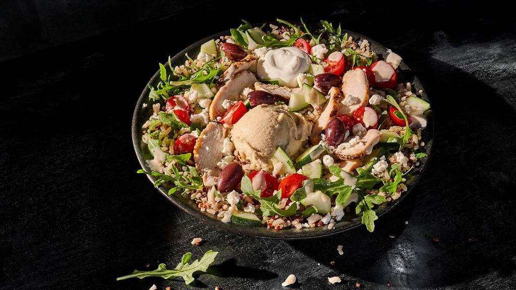 Mediterranean Bowl With Chicken · 680 Cal. Cilantro lime brown rice and quinoa, chicken raised without antibiotics, arugula, grape tomatoes, Kalamata olives, cucumbers, hummus, lemon tahini dressing, feta and Greek yogurt. Allergens: Contains Milk. May contain Wheat, Soy