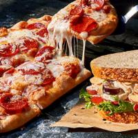 Flatbread Pizza And Sandwich · Selection of a flatbread pizza and a half sandwich