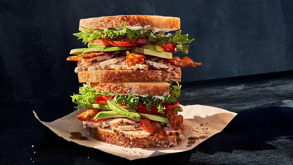 Roasted Turkey & Avocado Blt · Whole (950 Cal.), Half (480 Cal.) Roasted turkey raised without antibiotics, Applewood-smoked bacon, emerald greens, vine-ripened tomatoes, fresh avocado, mayo, salt, and pepper on Country Rustic Sourdough. Allergens: Contains Wheat, Egg