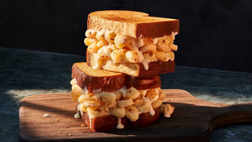 Grilled Mac & Cheese Sandwich · Whole (850 Cal.), Half (430 Cal.) Creamy Mac & Cheese with our fontina and mozzarella cheese blend and parmesan crisps on toasted thick-sliced Classic White Miche. Allergens: Contains Wheat, Milk, Egg