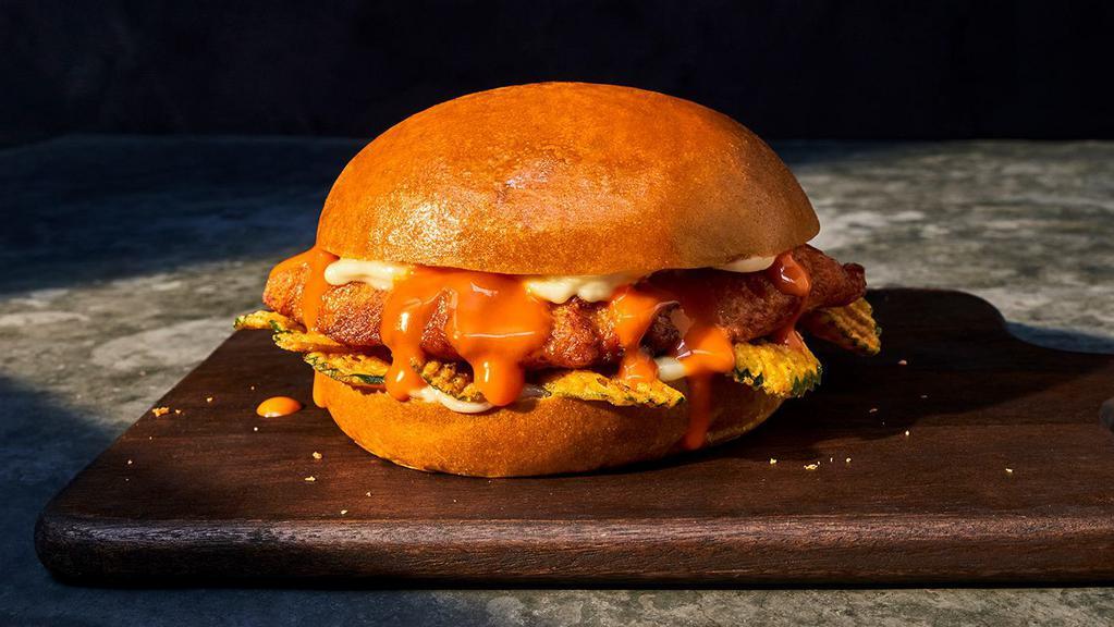 New The Spicy Take Chicken Sandwich · 580 Cal. Seasoned and seared chicken breast, spicy Buffalo sauce, crispy pickle chips, and garlic aioli on a brioche roll. Allergens: Contains Wheat, Milk, Egg