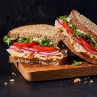 Deli Turkey Sandwich · Whole (590 Cal.), Half (300 Cal.) Oven-roasted turkey breast raised without antibiotics, eme...