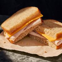 Kids Deli Turkey Sandwich · 290 Cal. Oven-roasted turkey breast raised without antibiotics and American cheese on White ...