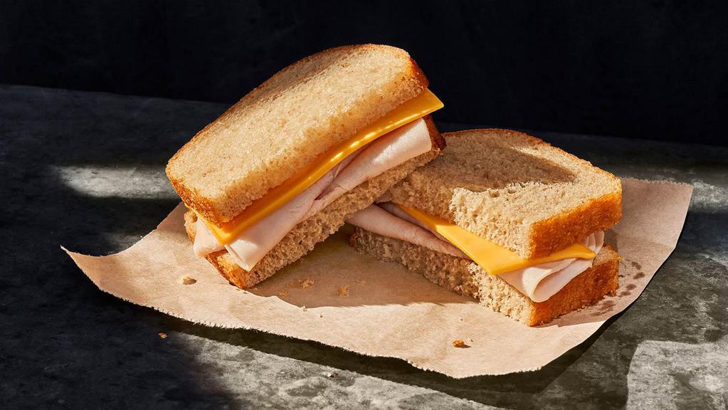 Kids Turkey Sandwich · 290 Cal. Oven-roasted turkey breast raised without antibiotics and American cheese on White Whole Grain Bread. Allergens: Contains Wheat, Milk