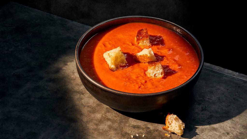 Creamy Tomato Soup · Bowl (350 Cal.), Cup (240 Cal.), Bread Bowl (910 Cal.), Group (850 Cal.) Vine-ripened pear tomatoes pureed with fresh cream for a velvety smooth flavor accented by hints of red pepper and oregano and topped with black pepper focaccia croutons. Allergens: Contains Wheat, Milk