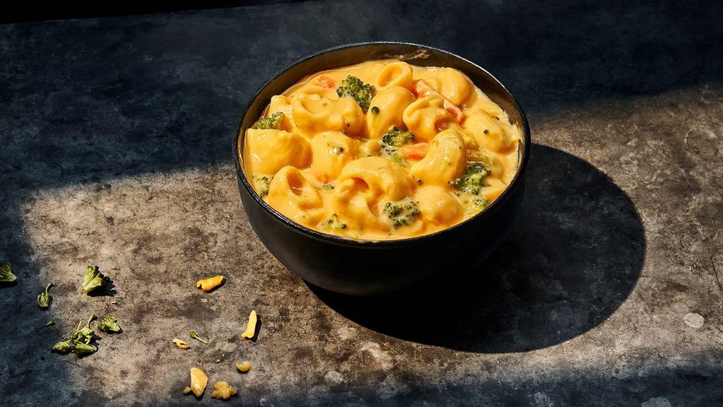 Broccoli Cheddar Mac & Cheese · Large (740 Cal.), Small (370 Cal.), Bread Bowl (1040 Cal.), Group (1480 Cal.) Shell pasta in a blend of creamy cheese sauce and tangy white cheddar, simmered with seasoned broccoli and carrots. Allergens: Contains Wheat, Milk, Egg