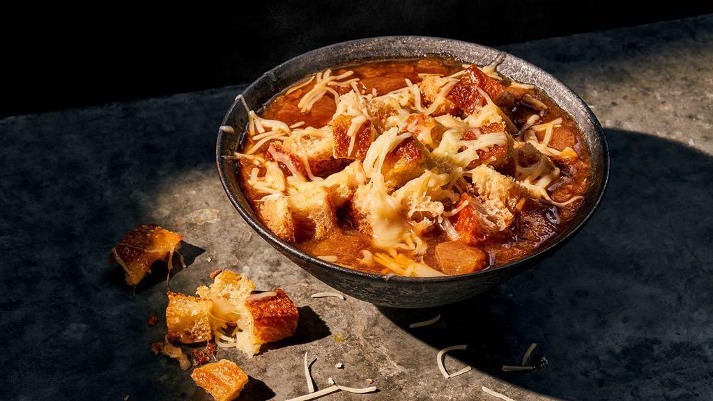 Bistro French Onion Soup · Bowl (310 Cal.), Cup (190 Cal.), Bread Bowl (850 Cal.), Group (600 Cal.) Sweet caramelized onions in a savory broth with a sherry wine vinegar gastrique,  sea salt, topped with gruyere and  our homemade black pepper focaccia croutons. Allergens: Contains Wheat, Soy, Milk