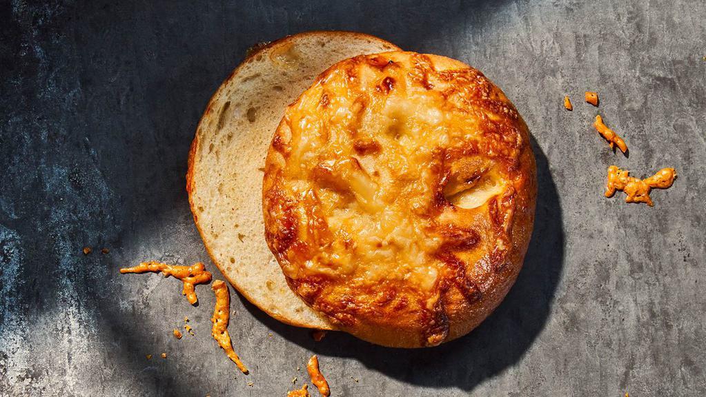 Asiago Bagel · 320 Cal. Freshly baked bagel made with chunks of asiago cheese baked inside and topped with more asiago. Allergens: Contains Wheat, Milk
