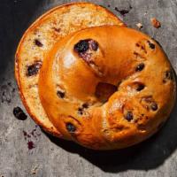 Blueberry Bagel · 290 Cal. Freshly baked bagel made with a mix of dried infused blueberries and blueberry flav...