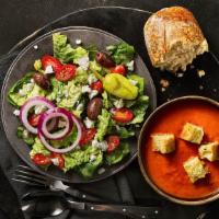 Greek Salad & Creamy Tomato Soup · A half portion of our Greek Salad served alongside a cup of Creamy Tomato Soup.