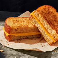 Kids Grilled Cheese · 230 Cal. Sliced American cheese grilled on White Whole Grain Bread. Allergens: Contains Whea...