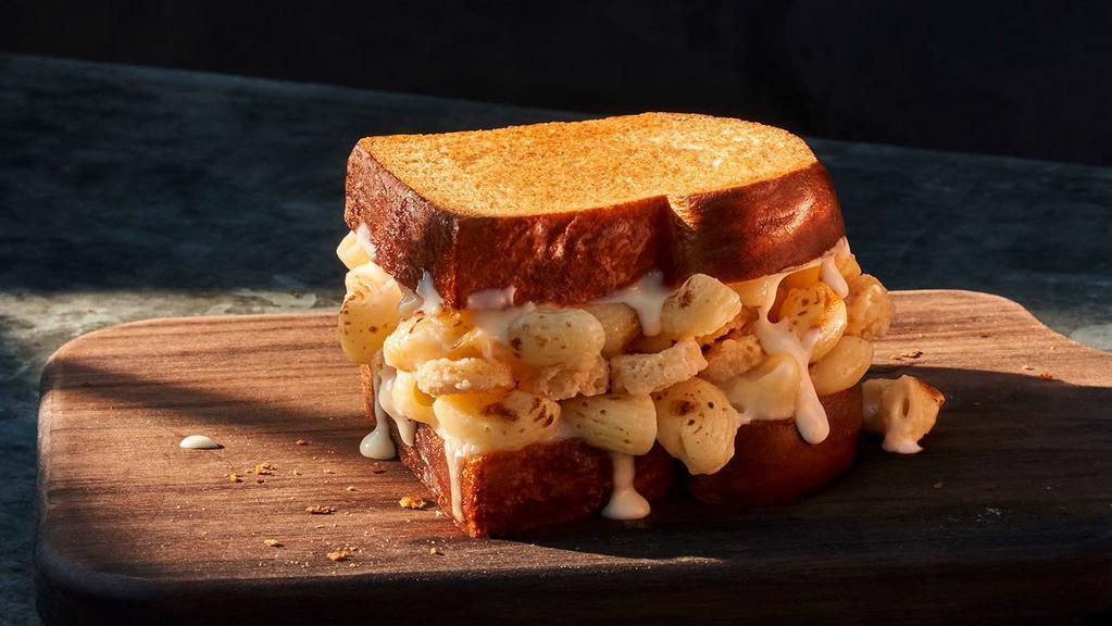 Kids Grilled Mac & Cheese Sandwich · 430 Cal. Creamy Mac & Cheese with our fontina and mozzarella cheese blend and parmesan crisps on toasted thick-sliced Classic White Miche. Allergens: Contains Wheat, Milk, Egg