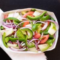 Green Salad · Lettuce, tomatoes, onions, bell peppers, and cucumber.