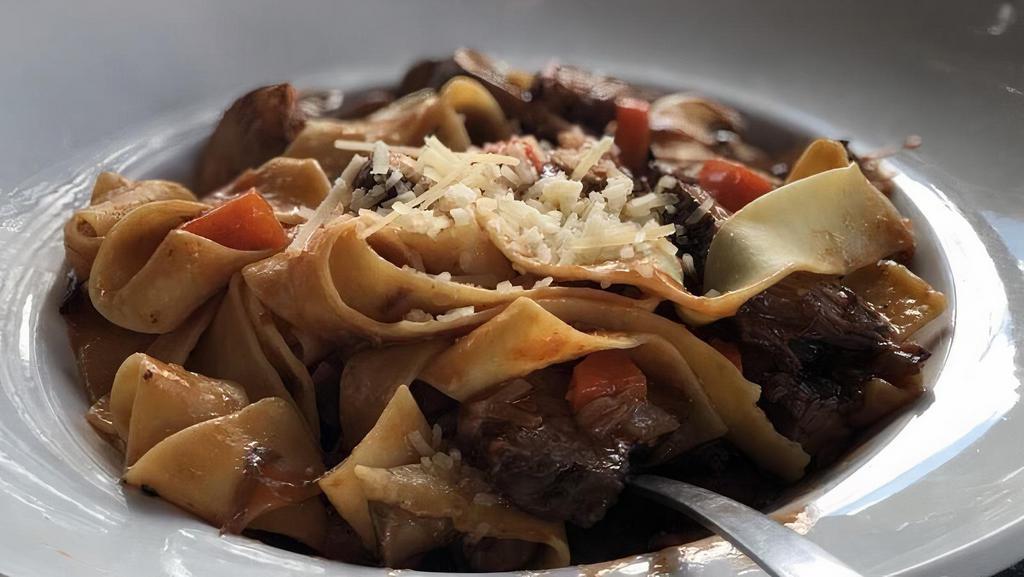 Short Rib Pappardelle · Tender certified angus beef ® short rib, sweet caramelized onions, brown butter, parmesan & crimini mushrooms with egg pappardelle pasta.