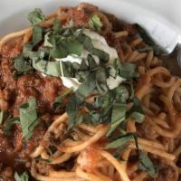 Spaghetti Bolognese · Slow cooked ground certified angus beef® in a housemade tomato marinara with garlic ricotta ...