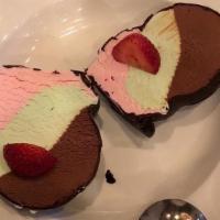 Spumoni Bomba · Pistachio, Strawberry & Chocolate Gelato in a Chocolate Shell.