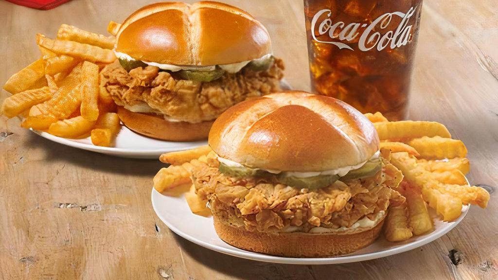 Spicy Chicken Sandwich Xl Combo · We placed over 65 years of delicious into this sandwich. Taste our legendary hand-battered chicken, topped with a signature honey-butter brushed brioche bun with mayo and pickles. Get more with two chicken sandwiches, a regular side, and large drink.